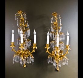 A pair of elegant Antique French Louis XVI ormolu bronze & cut crystal wall sconces.