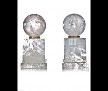 Pair cut rock crystal ball ornaments.